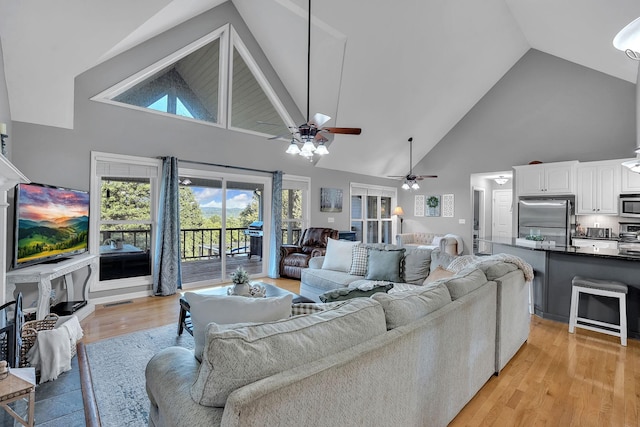 268 Crest Dr, Lynchburg, TN 37352 - living area with high vaulted ceiling, a ceiling fan, and light wood-style floors