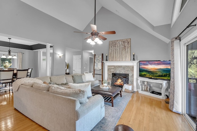 268 Crest Dr, Lynchburg, TN 37352 - living room featuring high vaulted ceiling, a ceiling fan, light wood-style floors, and a fireplace