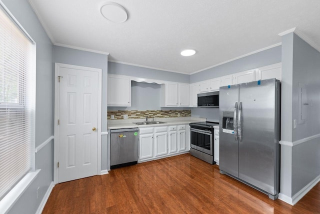 3357 Oak Trees Ct, Antioch, TN 37013 - kitchen featuring stainless steel appliances, white cabinetry, light countertops, dark wood-type flooring, and decorative backsplash