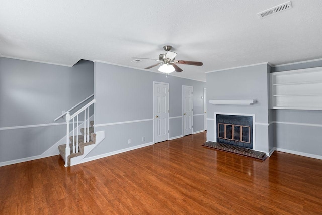 3357 Oak Trees Ct, Antioch, TN 37013 - unfurnished living room featuring ornamental molding, a ceiling fan, wood finished floors, stairs, and a fireplace