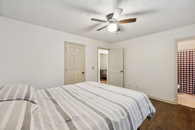 4651 Cynthia Ln, Murfreesboro, TN 37127 - bedroom with wood finished floors, a textured ceiling, a ceiling fan, and connected bathroom