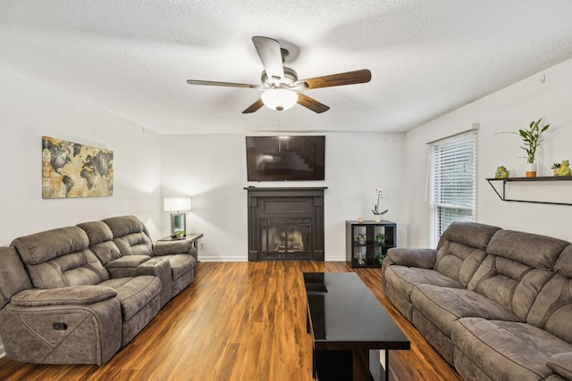 4651 Cynthia Ln, Murfreesboro, TN 37127 - living area featuring a ceiling fan, a textured ceiling, wood finished floors, and a fireplace