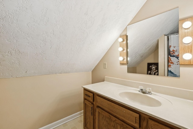 4651 Cynthia Ln, Murfreesboro, TN 37127 - bathroom featuring vaulted ceiling, a textured ceiling, and vanity