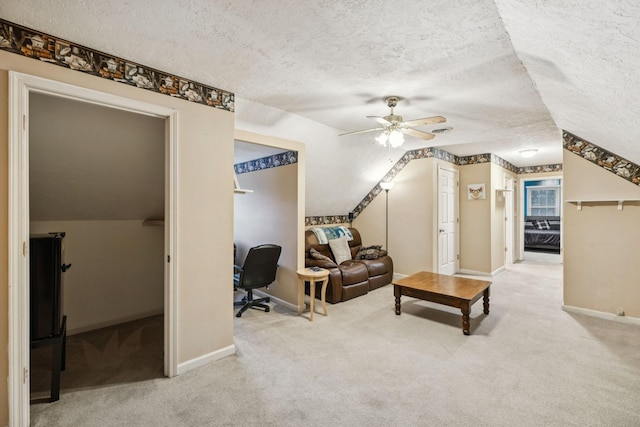 4651 Cynthia Ln, Murfreesboro, TN 37127 - carpeted living area with a textured ceiling, a ceiling fan, an office area, and vaulted ceiling