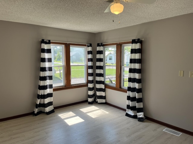 538 Lincoln St, Pulaski, TN 38478 - spare room with light wood-type flooring, a textured ceiling, and a ceiling fan