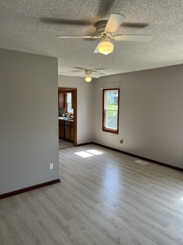 538 Lincoln St, Pulaski, TN 38478 - unfurnished room with a textured ceiling, wood finished floors, and ceiling fan