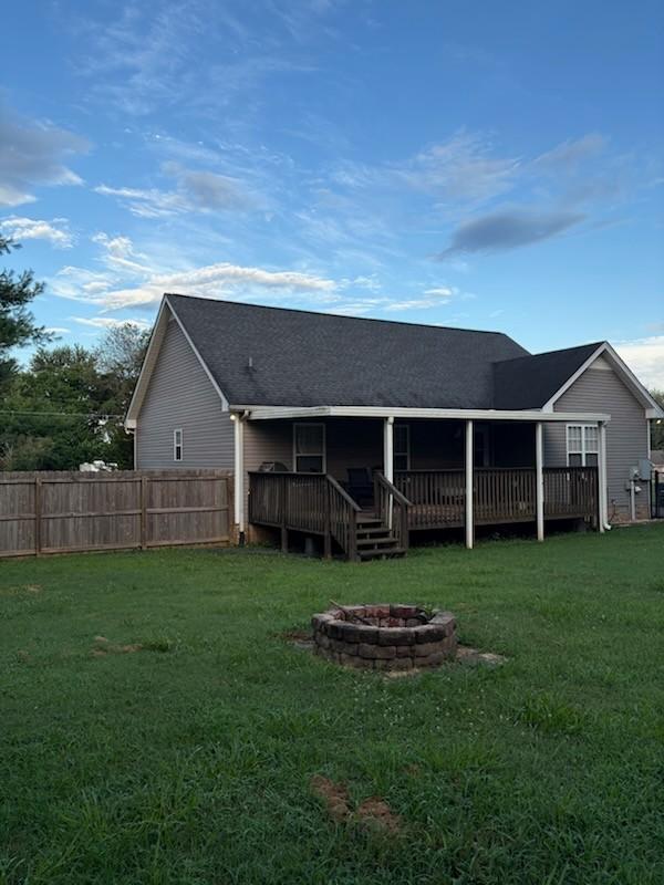 101 Jasmine Way N, Portland, TN 37148 - rear view of property featuring a fire pit, a wooden deck, and roof with shingles