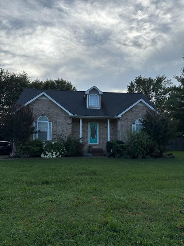 101 Jasmine Way N, Portland, TN 37148 - view of front of home featuring a front lawn and brick siding
