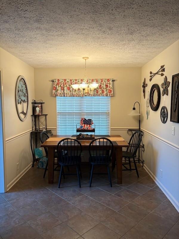 101 Jasmine Way N, Portland, TN 37148 - dining space featuring a textured ceiling, a chandelier, and dark tile patterned floors