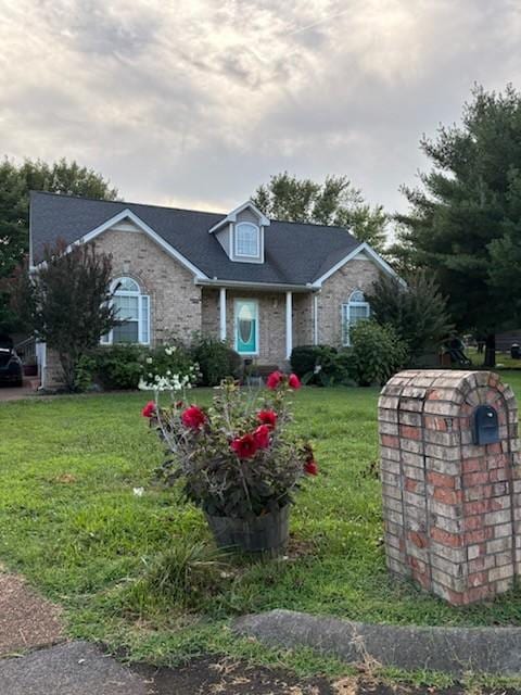 101 Jasmine Way N, Portland, TN 37148 - view of front of property with a front yard and brick siding