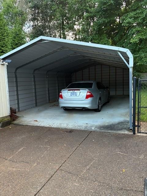 101 Jasmine Way N, Portland, TN 37148 - view of parking with asphalt driveway, a detached carport, and a gate