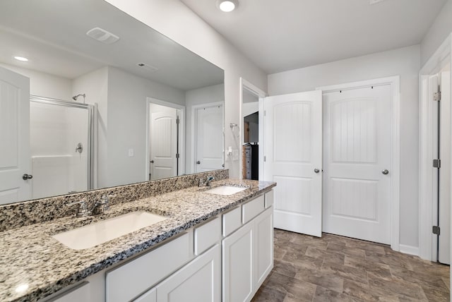 125 Stammer Farms Blvd, Chapel Hill, TN 37034 - full bath featuring double vanity, a stall shower, stone finish flooring, recessed lighting, and a closet