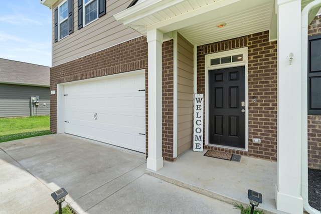 125 Stammer Farms Blvd, Chapel Hill, TN 37034 - view of exterior entry with brick siding, a garage, and concrete driveway