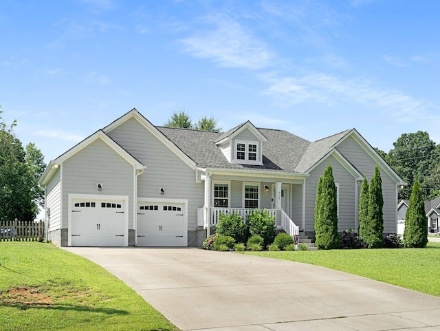 310 Diane Loop, White Bluff, TN 37187 - view of front of property featuring a porch, concrete driveway, an attached garage, and roof with shingles