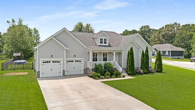 310 Diane Loop, White Bluff, TN 37187 - view of front facade with a porch, concrete driveway, and an attached garage