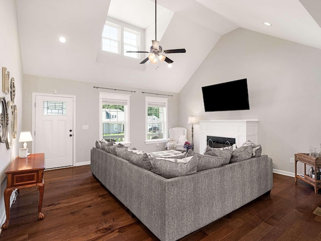 310 Diane Loop, White Bluff, TN 37187 - living area featuring high vaulted ceiling, ceiling fan, dark wood-style floors, a fireplace, and healthy amount of natural light