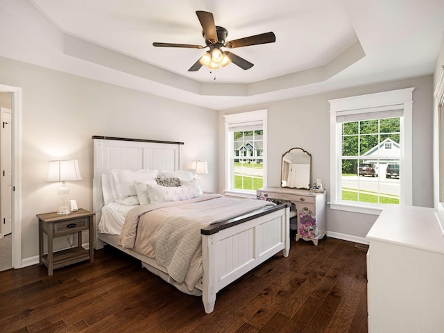 310 Diane Loop, White Bluff, TN 37187 - bedroom featuring a tray ceiling, dark wood-style flooring, and a ceiling fan