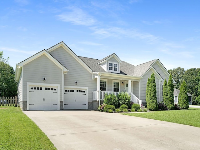 310 Diane Loop, White Bluff, TN 37187 - view of front of house featuring covered porch, driveway, an attached garage, and roof with shingles