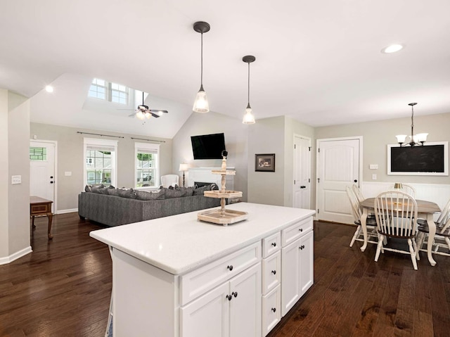310 Diane Loop, White Bluff, TN 37187 - kitchen featuring dark wood finished floors, a center island, white cabinets, light countertops, and hanging light fixtures