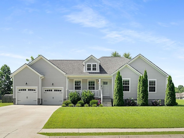 310 Diane Loop, White Bluff, TN 37187 - view of front facade featuring a porch, driveway, a front lawn, a garage, and a shingled roof