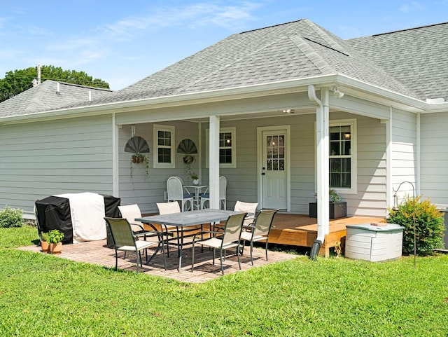 310 Diane Loop, White Bluff, TN 37187 - back of property featuring a lawn, a patio, and a shingled roof