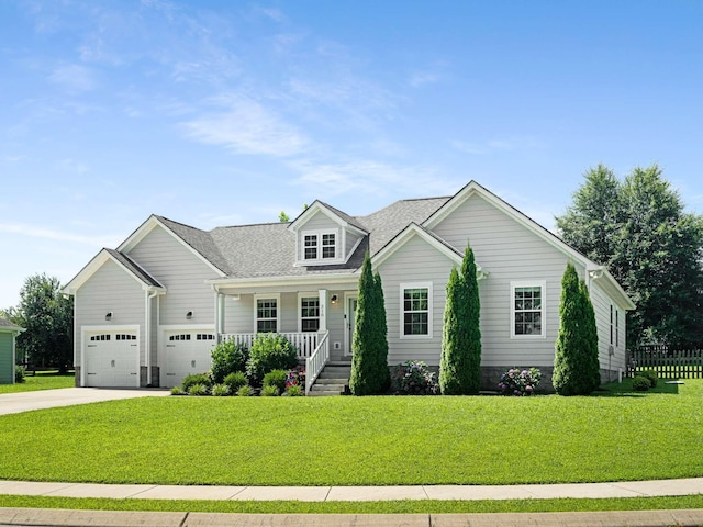 310 Diane Loop, White Bluff, TN 37187 - view of front of home with covered porch, concrete driveway, a front yard, and a garage