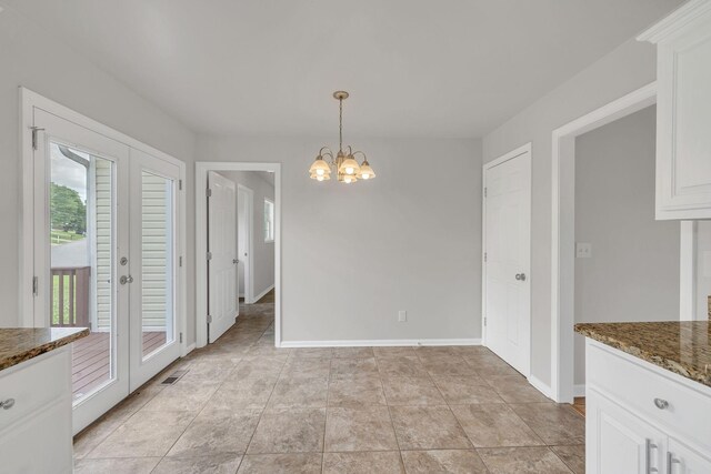 2995 Pipkin Hills Dr, Spring Hill, TN 37174 - unfurnished dining area with a chandelier and baseboards