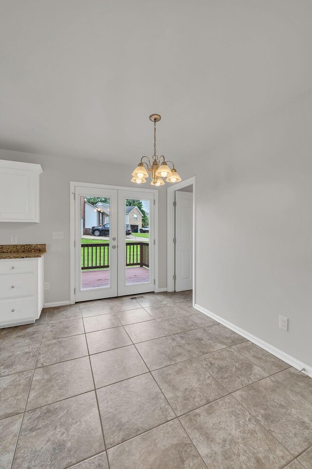 2995 Pipkin Hills Dr, Spring Hill, TN 37174 - unfurnished dining area with a chandelier, french doors, and light tile patterned floors
