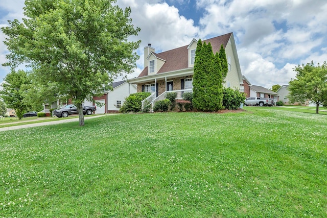 2995 Pipkin Hills Dr, Spring Hill, TN 37174 - view of front of property featuring a porch, a chimney, a front yard, and brick siding