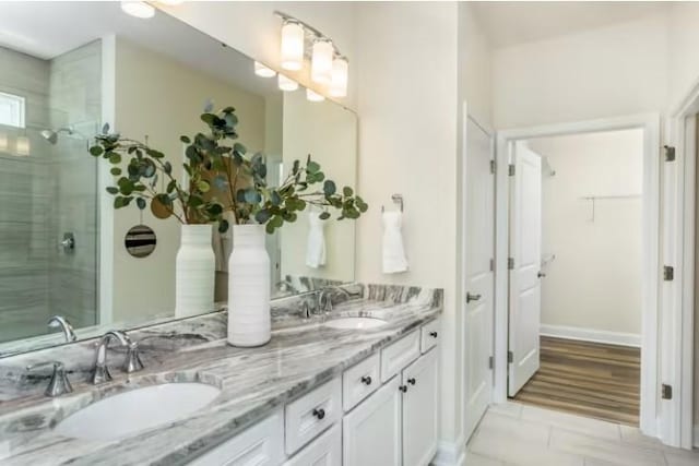 404 Sharp Way, Murfreesboro, TN 37128 - full bathroom featuring double vanity, a tile shower, a walk in closet, and tile patterned floors