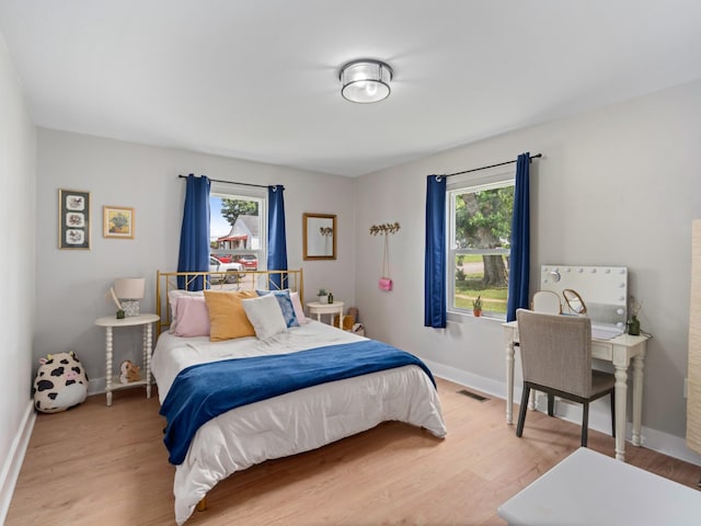2011 Denham Ave, Columbia, TN 38401 - bedroom featuring multiple windows and light wood-type flooring