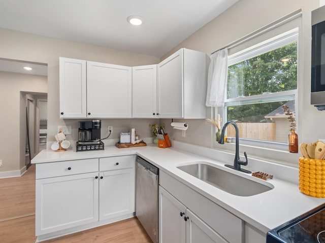 2011 Denham Ave, Columbia, TN 38401 - kitchen with dishwasher, white cabinetry, light countertops, recessed lighting, and light wood-style flooring