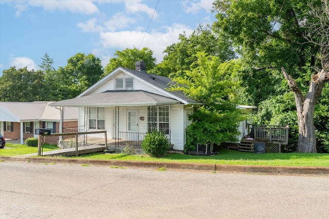 45 Lawn St, Clarksville, TN 37040 - bungalow-style home featuring a porch and a chimney