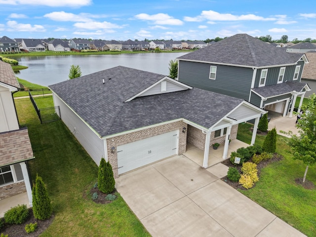 3702 Mathewson Way, Murfreesboro, TN 37128 - view of front of home with a residential view, roof with shingles, driveway, brick siding, and a water view