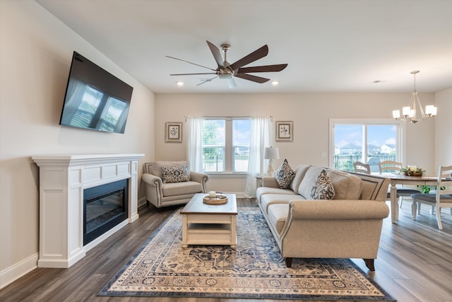 3702 Mathewson Way, Murfreesboro, TN 37128 - living area featuring a chandelier, ceiling fan, a glass covered fireplace, dark wood-style flooring, and recessed lighting