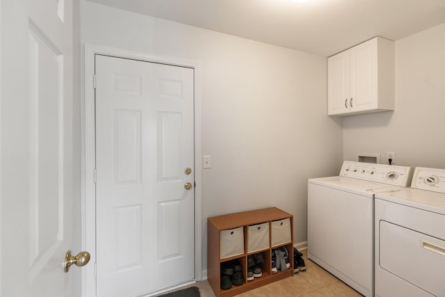1902 Baileys Trace Dr, Spring Hill, TN 37174 - washroom featuring washing machine and clothes dryer, cabinet space, and light tile patterned floors