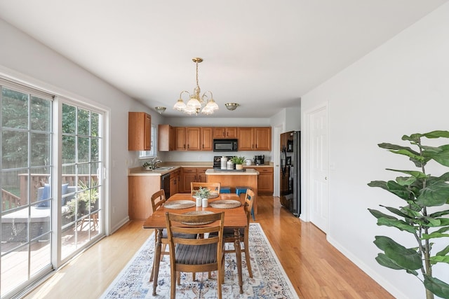 1902 Baileys Trace Dr, Spring Hill, TN 37174 - dining space featuring a chandelier and light wood-type flooring
