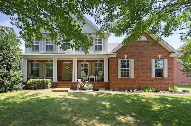 1902 Baileys Trace Dr, Spring Hill, TN 37174 - traditional-style house featuring a front yard, covered porch, and brick siding