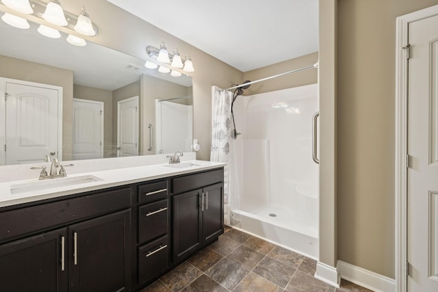 510 Sourwood Dr, Clarksville, TN 37042 - bathroom featuring double vanity, curtained shower, and stone finish floors