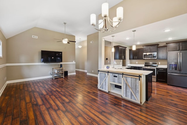 510 Sourwood Dr, Clarksville, TN 37042 - kitchen with appliances with stainless steel finishes, open floor plan, light countertops, dark wood-style flooring, and vaulted ceiling