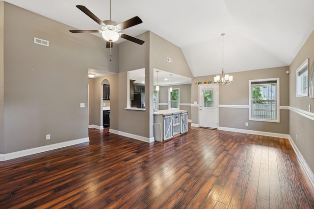 510 Sourwood Dr, Clarksville, TN 37042 - unfurnished living room with a chandelier, a ceiling fan, dark wood-style flooring, arched walkways, and high vaulted ceiling