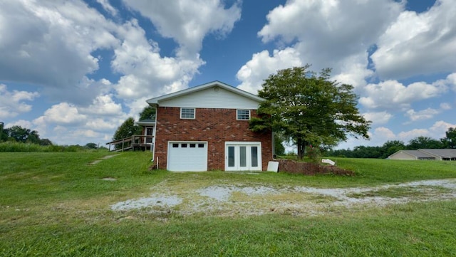 51 Poppy Ln, Ringgold, GA 30736 - view of home's exterior with brick siding, a garage, and a yard