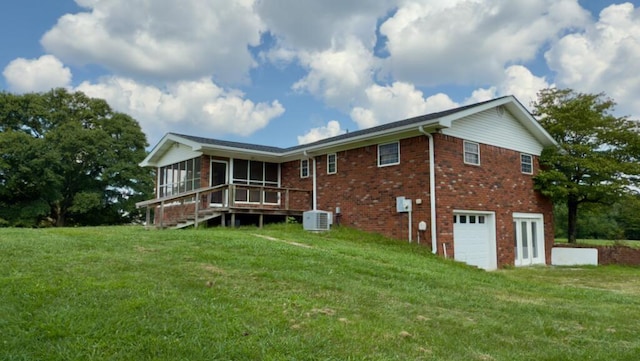 51 Poppy Ln, Ringgold, GA 30736 - rear view of house featuring a sunroom, a garage, a lawn, and brick siding