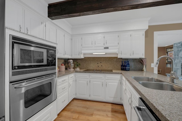 301 Brandywine Dr, Old Hickory, TN 37138 - kitchen with appliances with stainless steel finishes, crown molding, white cabinets, under cabinet range hood, and light wood finished floors