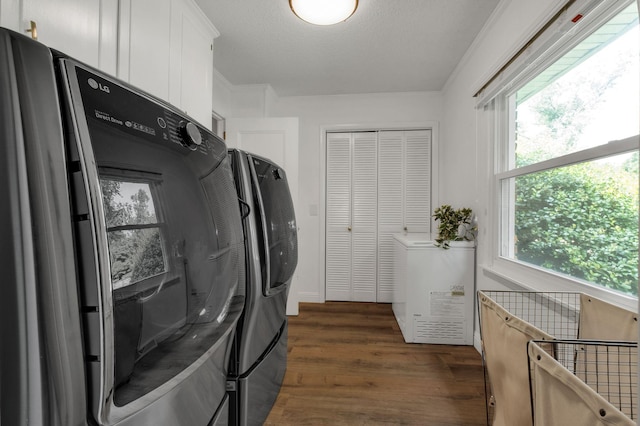 301 Brandywine Dr, Old Hickory, TN 37138 - laundry area featuring dark wood-type flooring, plenty of natural light, cabinet space, and washing machine and dryer