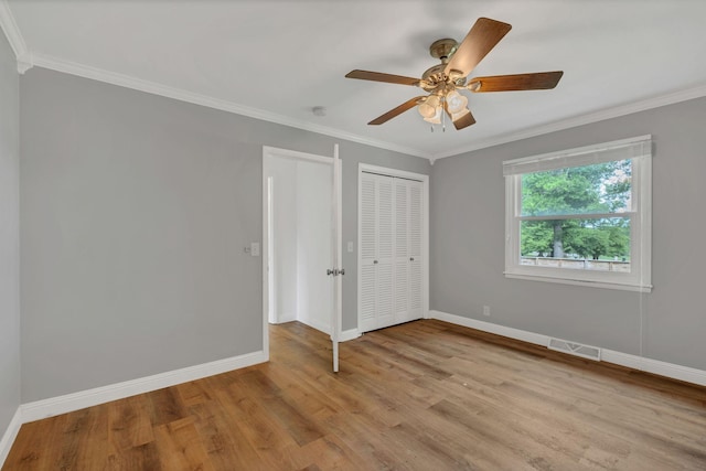 301 Brandywine Dr, Old Hickory, TN 37138 - unfurnished bedroom featuring ornamental molding, light wood finished floors, a closet, and a ceiling fan