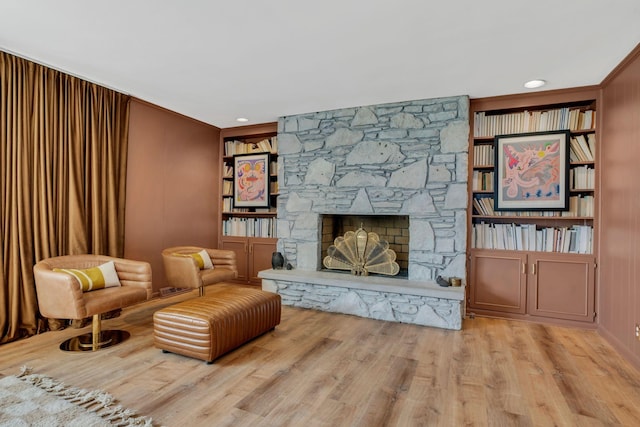 301 Brandywine Dr, Old Hickory, TN 37138 - living room with a stone fireplace, wood finished floors, built in features, and crown molding