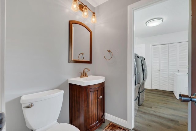 301 Brandywine Dr, Old Hickory, TN 37138 - bathroom featuring vanity, washing machine and clothes dryer, and wood finished floors