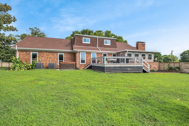301 Brandywine Dr, Old Hickory, TN 37138 - back of property featuring a hot tub, a wooden deck, brick siding, and a fenced backyard
