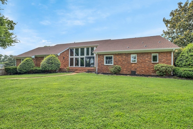 301 Brandywine Dr, Old Hickory, TN 37138 - rear view of house with brick siding, a yard, and roof with shingles